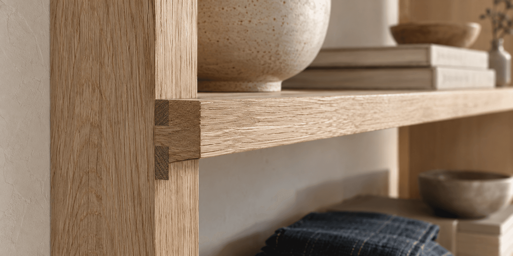 Close detail of a precise oak shelf joint